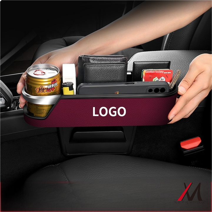 Car seat gap organiser with cup holder holding drink and phone